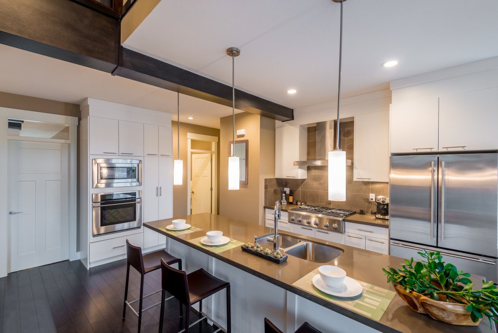 Modern, bright, clean, kitchen interior with stainless steel app